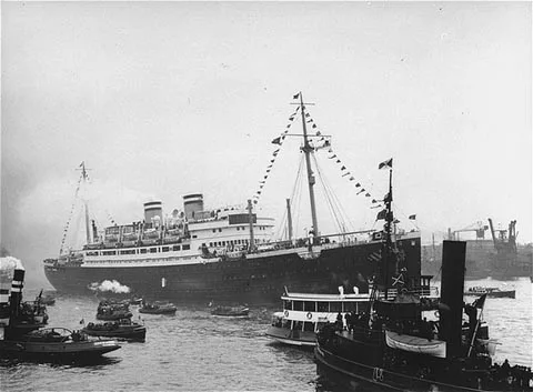 The refugee ship St. Louis surrounded by smaller vessels in 1939
